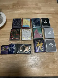 Official Pokemon Card Sleeve Lot Of 10 packs and 2 miscellaneous packs - Image 1