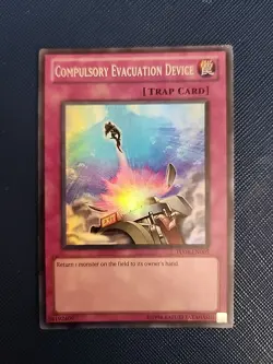 Yugioh Compulsory Evacuation Device TU04-EN005 Unlimited Super Rare Near Mint - Image 1