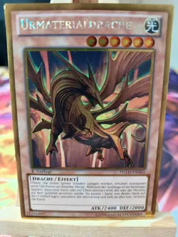 Urmaterialdrache PGLD-DE065 Gold Rare Deutsch EX YUGIOH - Image 1