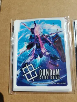 Gundam Card Game ST04-002 Strike Gundam Kira Promo Card Set & Sleeves - Image 3