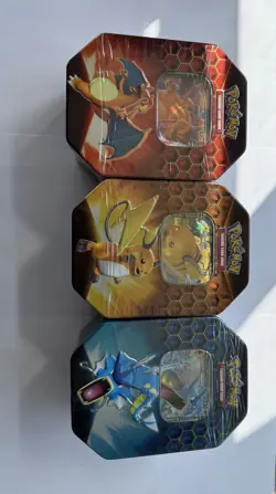 Pokemon Hidden Fates Tins Set Of 3 Charizard, Raichu, Gyarados - Image 1