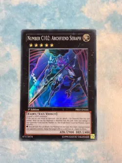 YUGIOH NUMBER C102: ARCHFIEND SERAPH SUPER RARE 1ST EXC PRIO-EN044 - Image 1