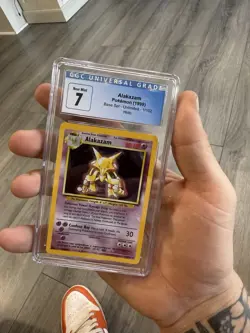 1999 POKEMON BASE SET UNLIMITED #1 ALAKAZAM-HOLO CGC 7 Near Mint - Image 1