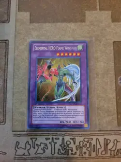 YUGIOH ELEMENTAL HERO FLAME WINGMAN LCGX-EN045 SECRET 1ST ED NM - Image 1