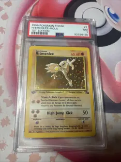 PSA 7 Hitmonlee 7/62 Fossil Holo 1st Edition Pokemon Card - Image 1