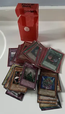 Lot of 104 Mixed YUGIOH Cards, Plus Deck Box, Some Are In Sleeves - Image 1