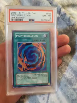 PSA 8 NM-MT Polymerization 059 2010-17 LOB Reprint Holo Yugioh Card - Image 1