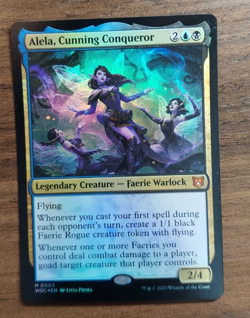 1x Alela, Cunning Conqueror - FOIL NM Wilds of Eldraine Commander SPARROW MAGIC - Image 1