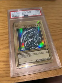 2020 Yugioh Maximum Gold 1st Edition Blue-Eyes White Dragon MAGO-EN001 PSA 7 - Image 1