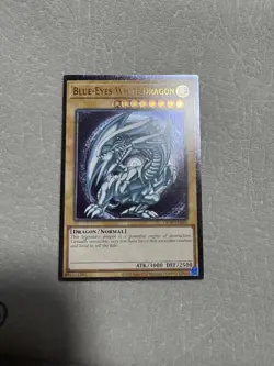 YUGIOH Blue-Eyes White Dragon Ultimate Rare OTS-28 Near Mint, Very Slight Miscut - Image 1