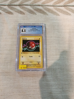 Pokemon TCG Voltorb Base Set 1st Edition, CGC graded 8.5! - Image 1