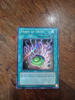 1st Edition Shard of Greed PHSW-EN057 Secret Rare Photon Shockwave YuGiOh Card N - Image 1