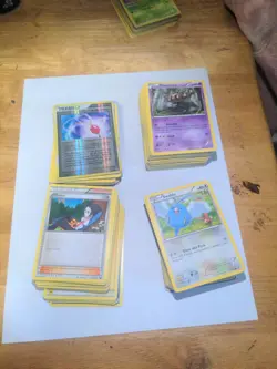 Pokemon Prismatic Evolutions Non-Holo Bulk (Approximately 150 Cards) - Image 1