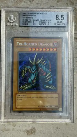 2002 YuGiOh Tri-Horned Dragon 1st Edition Secret LOB-000 BGS 8.5 PSA NA English - Image 1
