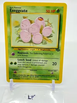 1999 EXEGGCUTE - LP 52/64 JUNGLE Pokemon Card WOTC COMMON - Image 1
