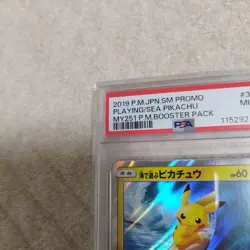 PSA 9 Pokemon Card Surfing Pikachu 329/SM-P Playing in the Sea Promo Japanese - Image 2