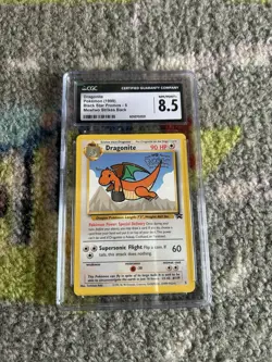 CGC 8.5 - 1999 Dragonite # 5 WB Movie WOTC Black Star PROMO Pokemon Card - Image 1