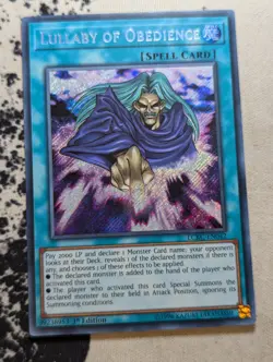 Yugioh Lullaby of Obedience LCKC-EN042 Secret Rare 1st Edition LP - Image 1