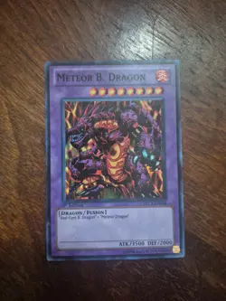 Yugioh Meteor B. Dragon PRC1-EN004 1ST SUPER (LP) - Image 1