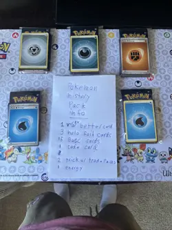 Pokemon mystery Pack.21 cards and 2 TCG packs. 1 v or better 3 holos an 15 basc￼ - Image 1